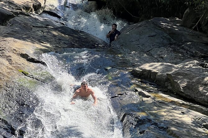 El Yunque Rainforest- Water Slide, Luquillo Beach Guided Tour - Guide style: safety-first energy and photo help that saves your hands