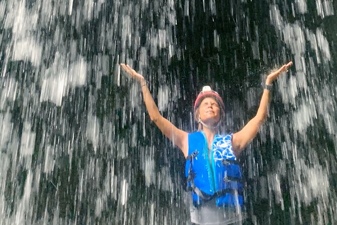 Explore Cuevas Charco Azul, Arenas and Playa de Aguas Cristalinas - Cave exploration setup: helmets, lamps, and life jackets, then a short walk in