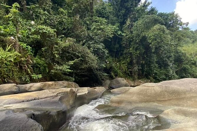 Full Day Eastern Island Tour - Stop 2: Las Pailas, river water, and a natural waterslide vibe