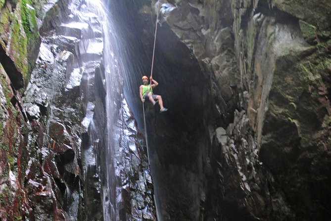Full-Day Zipline and Waterfall Rappelling Adventure Near San Juan - Getting ready to rappel: helmets, harnesses, and a safety-first mindset