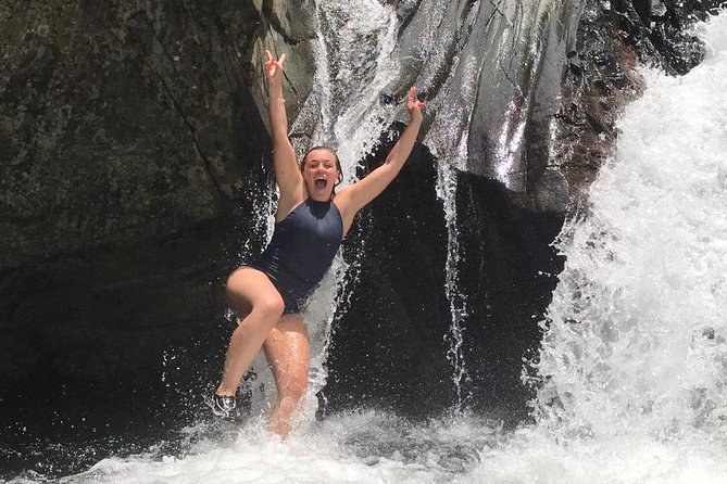 Half-Day Yunque Rainforest Waterslide & rope swing Guided Tour - Second waterfall stop: natural rock waterslide and the cliff jump
